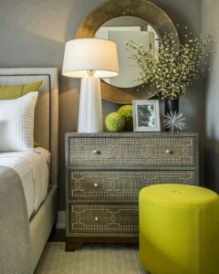 15-a-neutral-bedroom-can-be-spruced-up-with-greenery-pillows-and-ottomans
